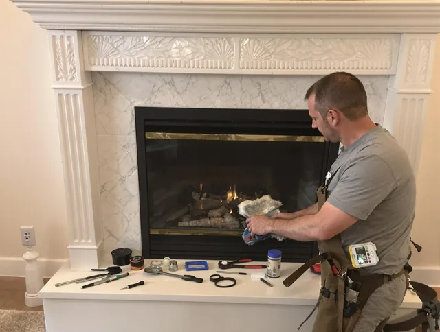 Holbrook Chimney Sweep performing fireplace maintenance in Holbrook, MA